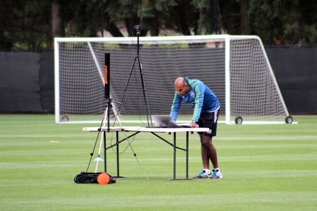 Ravi Ramineni analyzes wearable tracking data at a Sounders practice last month. 